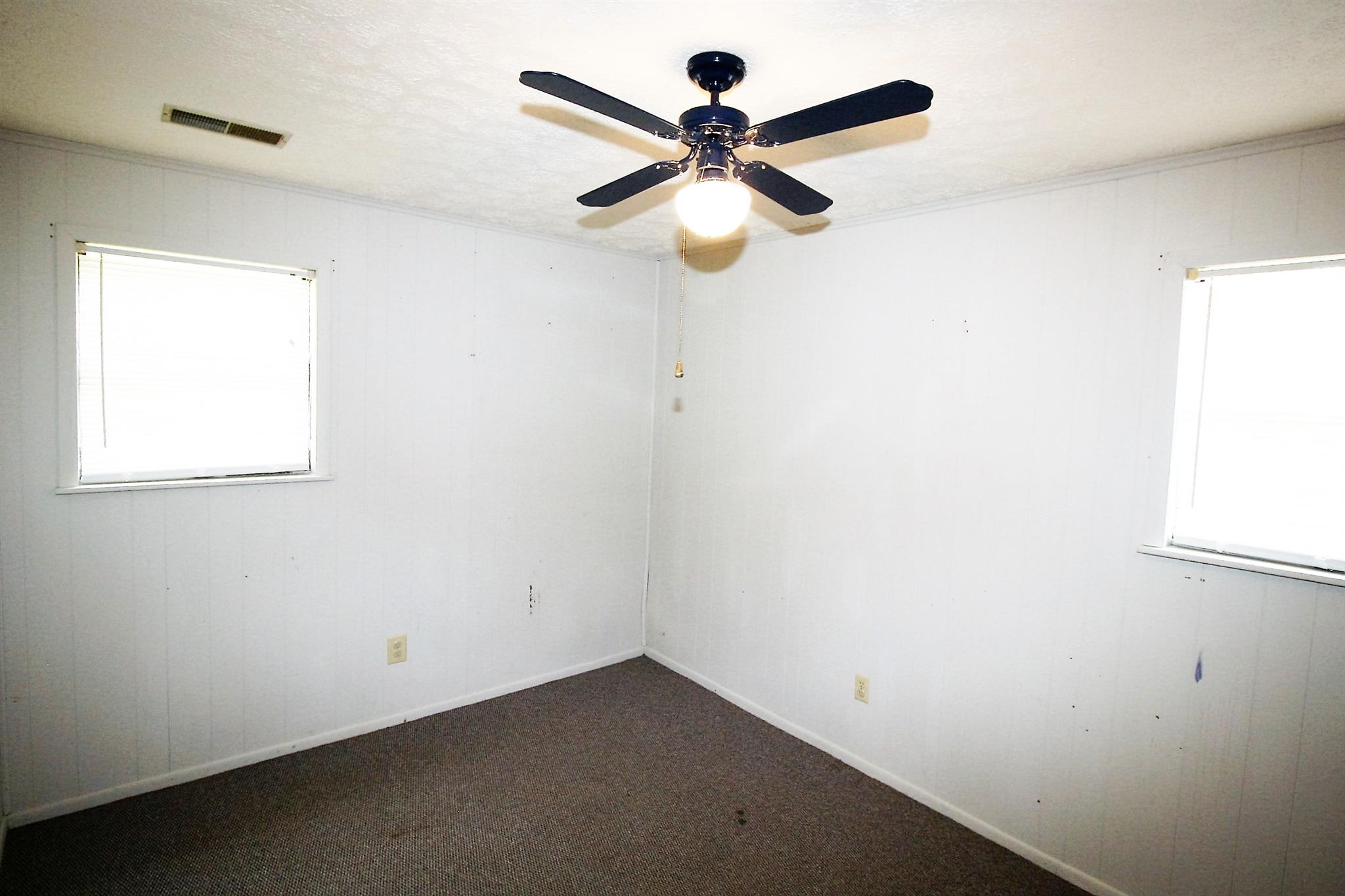 17550 Witty Mill Road Elkmont, AL 35620 - Photo 10 of 27 an empty room with a window and a fan