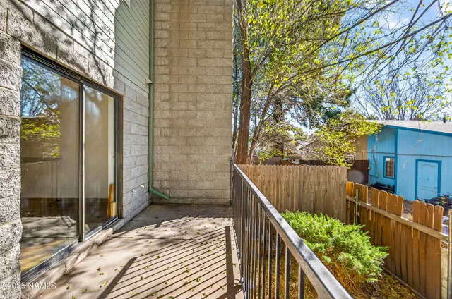 a balcony with view of outdoor space