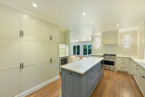 a kitchen with a sink and refrigerator
