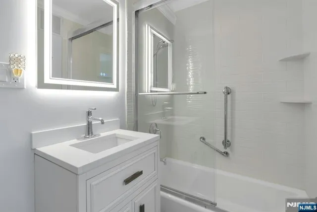 a bathroom with a sink and a mirror