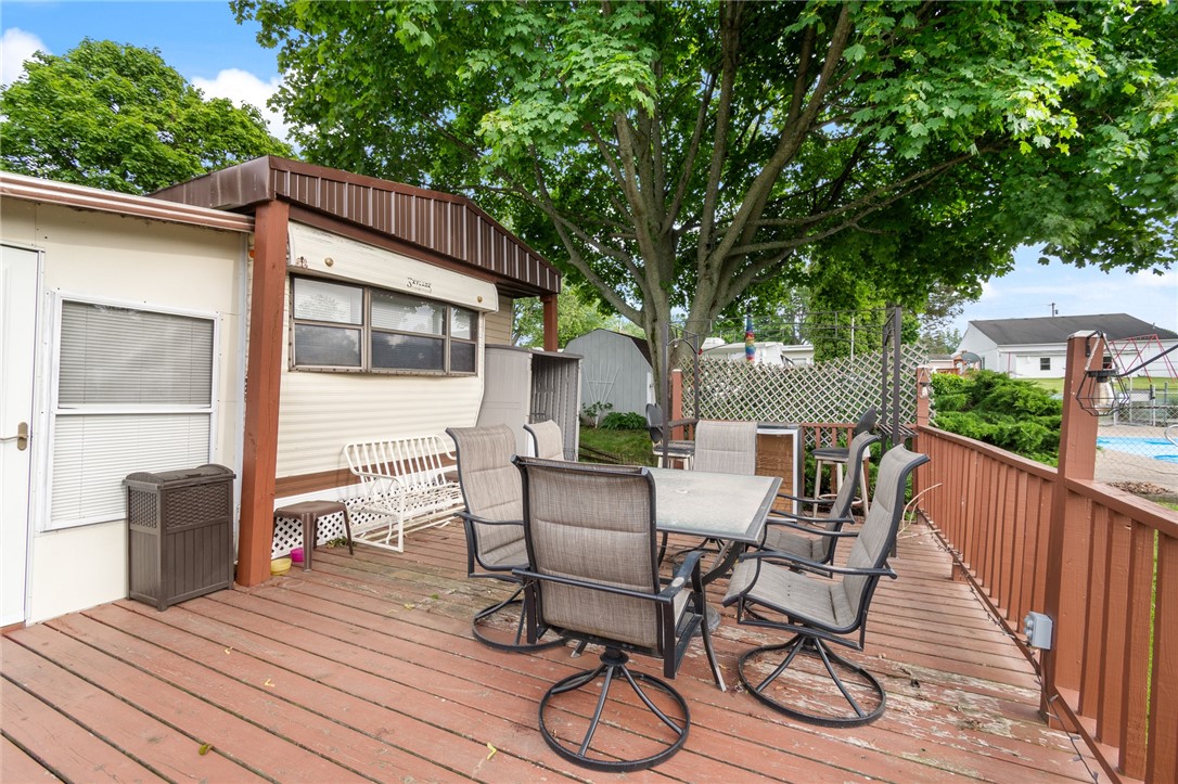 7945 Lake Road, Unit 44 AND 45 Sodus Point, NY 14555 - Photo 7 of 18 ENJOY THE DECK - SO CLOSE TO THE POOL TOO!