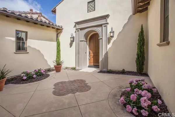 a view of a entryway with flower pots