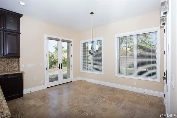 a kitchen with stainless steel appliances granite countertop a sink a counter space and wooden floor