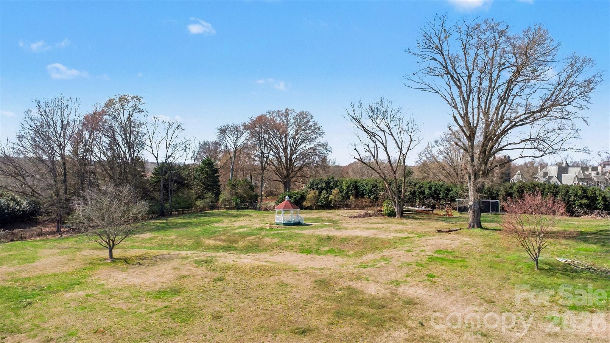 433 Weddington Church Road Waxhaw, NC 28173 - Photo 13 of 16 a swimming pool with lots of tress in the background