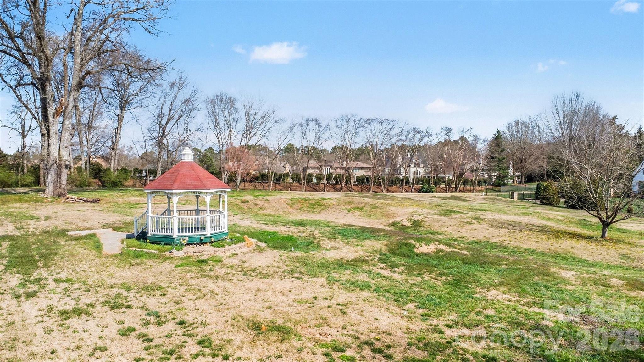 433 Weddington Church Road Waxhaw, NC 28173 - Photo 15 of 16 a view of a lake with a large trees