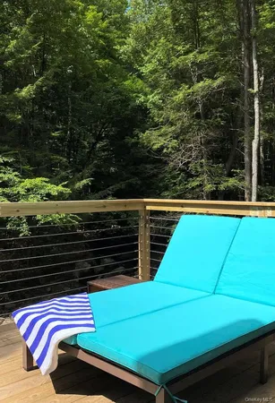 a dining room with furniture and a large window