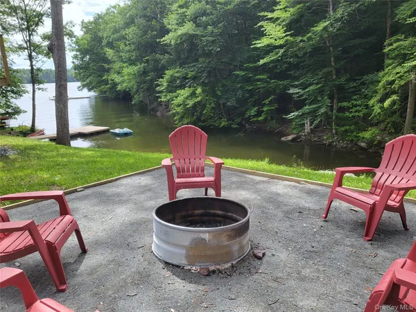 a childrens park with lots of swings slides and swimming pool