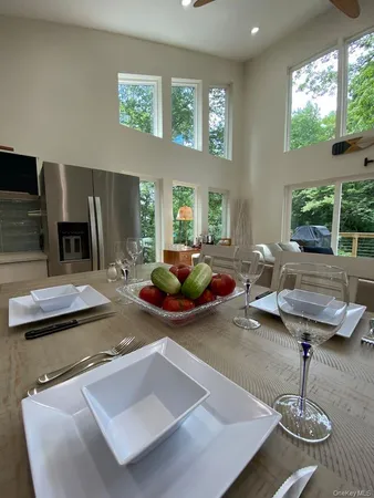 a room with furniture and view of living room