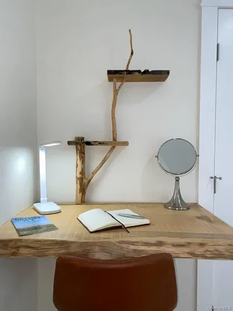 a bedroom with a bed and a mirror