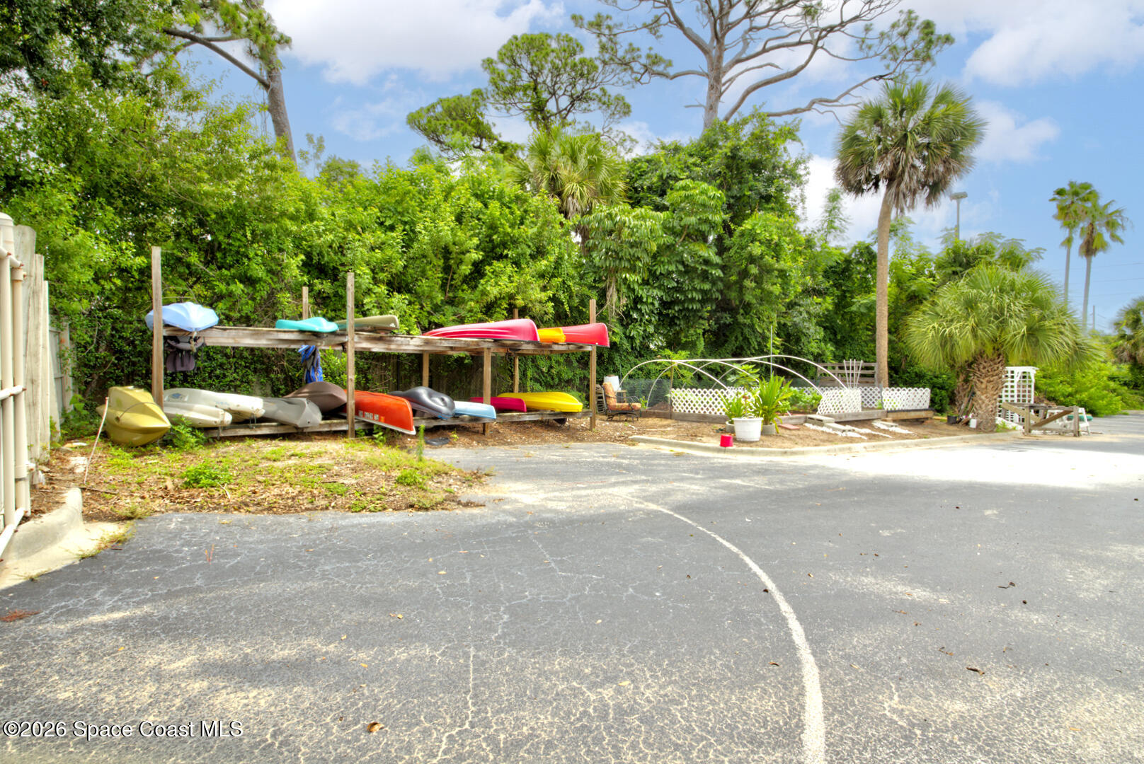 225 South Tropical Trail, Unit 605 Merritt Island, FL 32952 - Photo 28 of 36 Sunset Bay kayak storage & garden