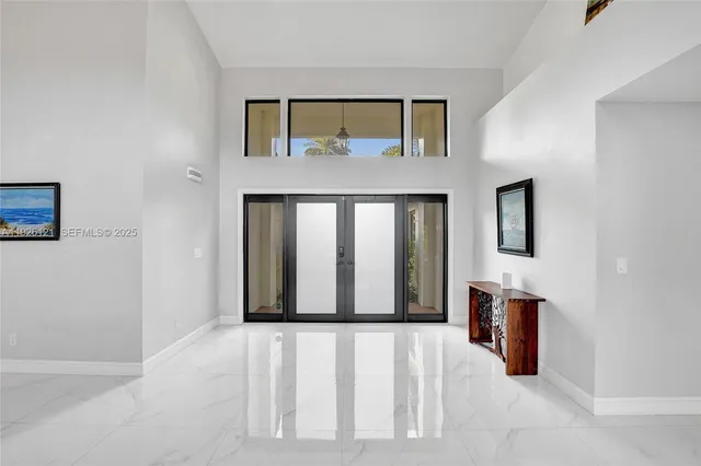 a kitchen with stainless steel appliances granite countertop a refrigerator sink and cabinets