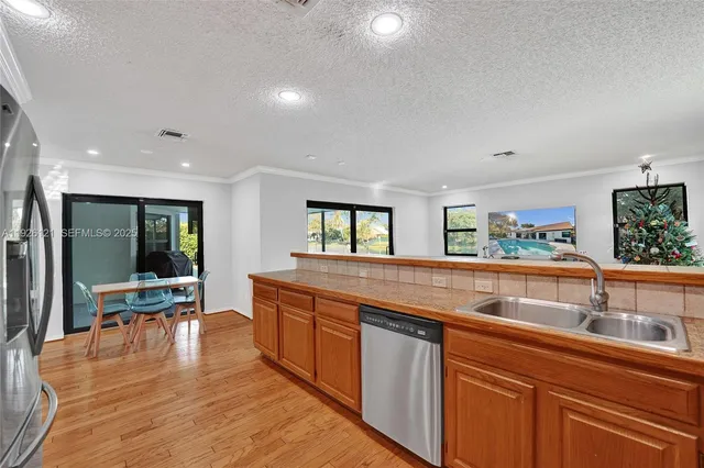 a view of a livingroom with furniture and a flat screen tv