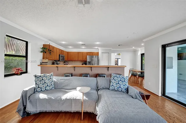 a bedroom with a bed and large window