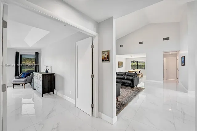 a spacious bedroom with a large bed and a window