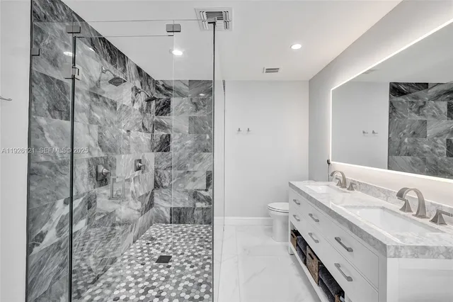 a bedroom with a bed and a chair