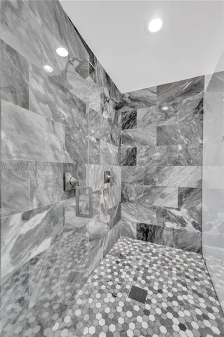 a view of a livingroom with a ceiling fan and window