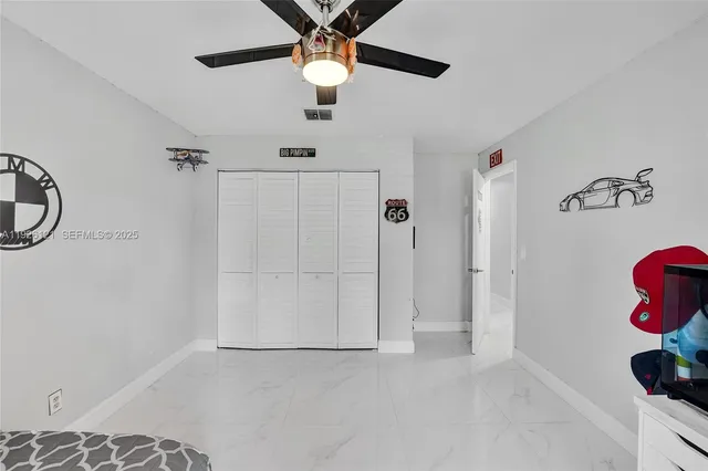 a room with furniture and large windows