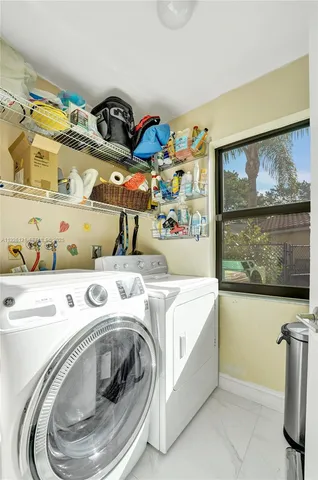 a view of swimming pool with a patio and a yard