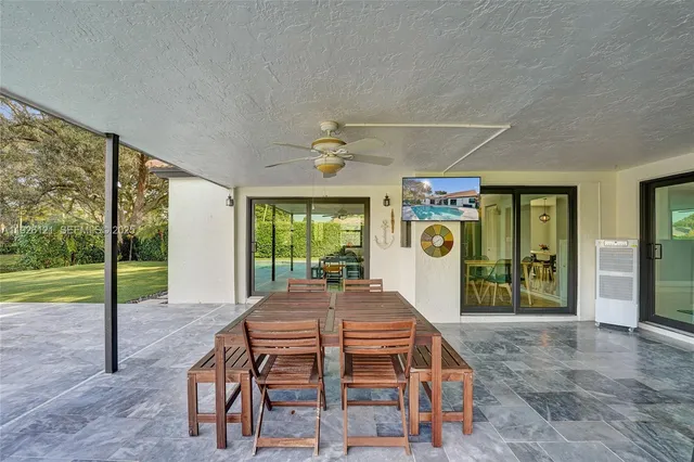 a view of a yard with basketball court