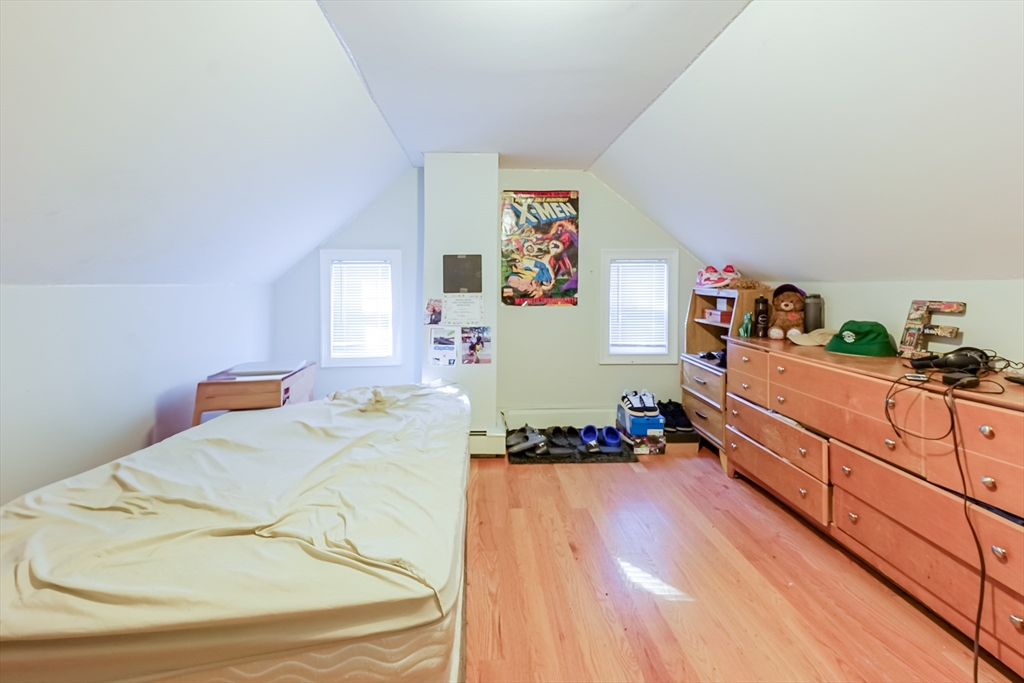 5 Oliver Street Randolph, MA 02368 - Photo 29 of 29 a bedroom with a bed and a dresser