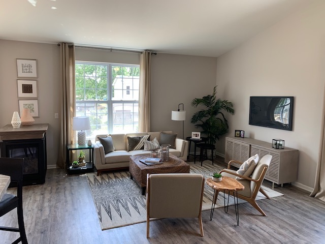 489 Ridge Road Bolingbrook, IL 60440 - Photo 11 of 34 a living room with furniture and a fireplace