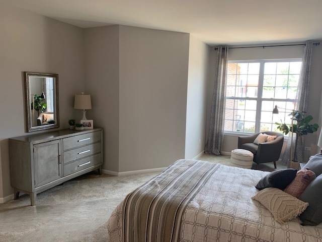 489 Ridge Road Bolingbrook, IL 60440 - Photo 13 of 34 a bedroom with a bed and furniture with window