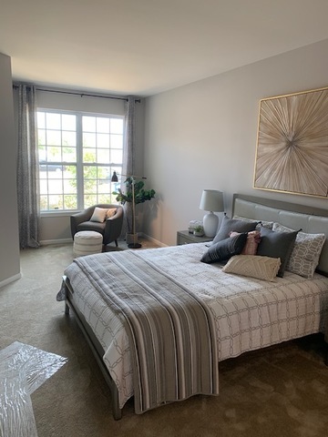 489 Ridge Road Bolingbrook, IL 60440 - Photo 15 of 34 a bedroom with bed and a large window