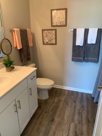 489 Ridge Road Bolingbrook, IL 60440 - Photo 18 of 34 a bathroom with a toilet sink and mirror