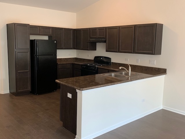 489 Ridge Road Bolingbrook, IL 60440 - Photo 24 of 34 a kitchen with stainless steel appliances granite countertop a refrigerator and a sink