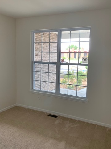 489 Ridge Road Bolingbrook, IL 60440 - Photo 27 of 34 an empty room with a window