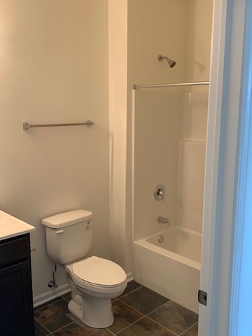 489 Ridge Road Bolingbrook, IL 60440 - Photo 30 of 34 a bathroom with a toilet and a shower