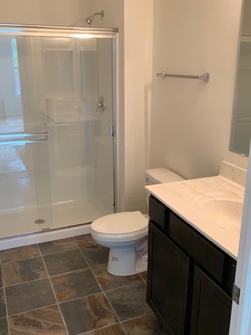 489 Ridge Road Bolingbrook, IL 60440 - Photo 31 of 34 a bathroom with a toilet a sink and shower
