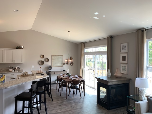 489 Ridge Road Bolingbrook, IL 60440 - Photo 10 of 34 a living room with furniture dining table and a large window