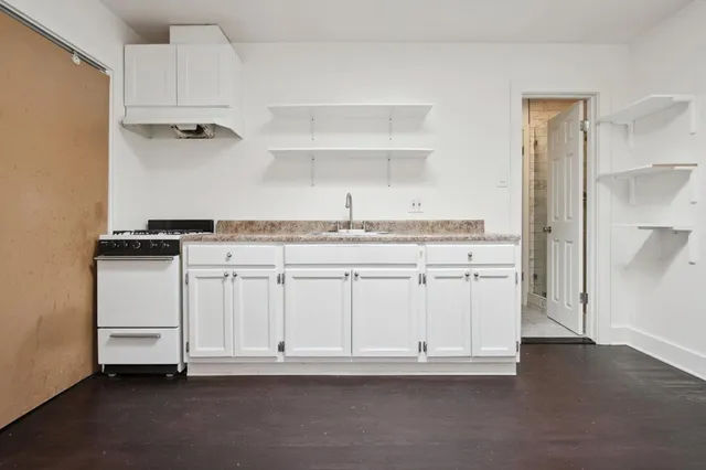 a view of cabinets with wooden floor