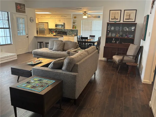 a living room with furniture and a table
