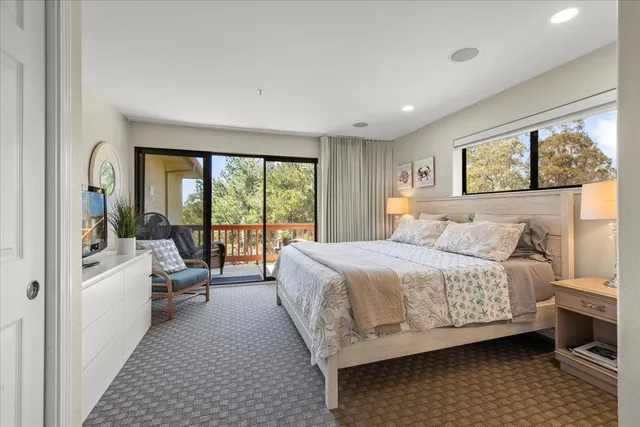 a bedroom with a bed and a table in it