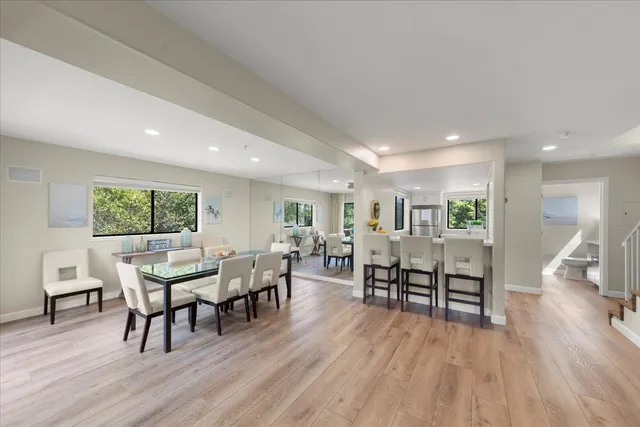 a view of a dining room with furniture window and wooden floor