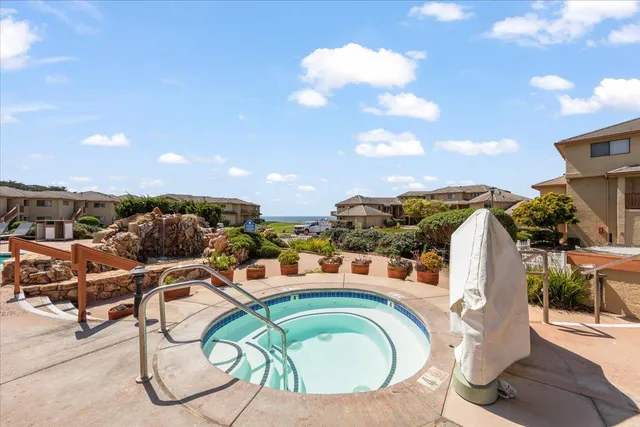 a aerial view of a house with a swimming pool yard and outdoor seating