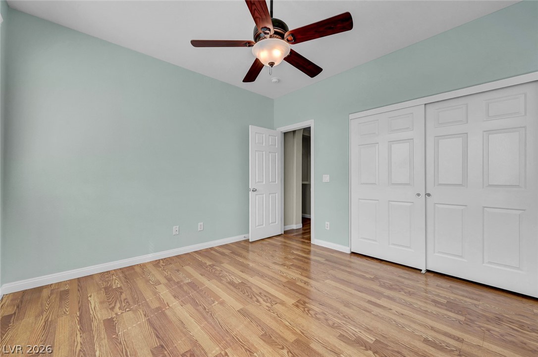 977 Sparkling Light Street Henderson, NV 89052 - Photo 56 of 75 This spacious room features rich wood flooring, crisp walls, and ample closet space.