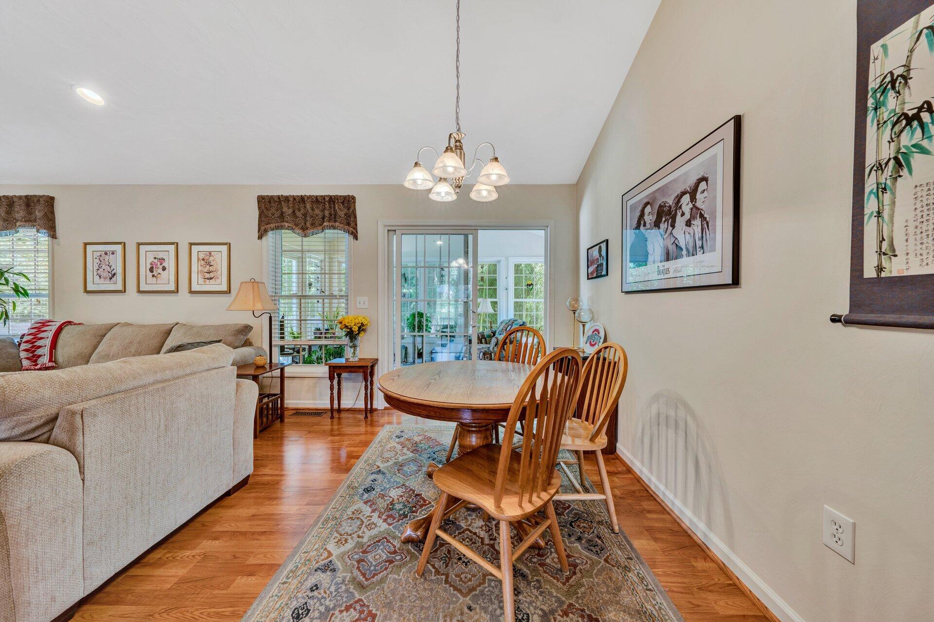 672 Kessler Mill Road Salem, VA 24153 - Photo 12 of 44 a living room with furniture a chandelier and a dining table