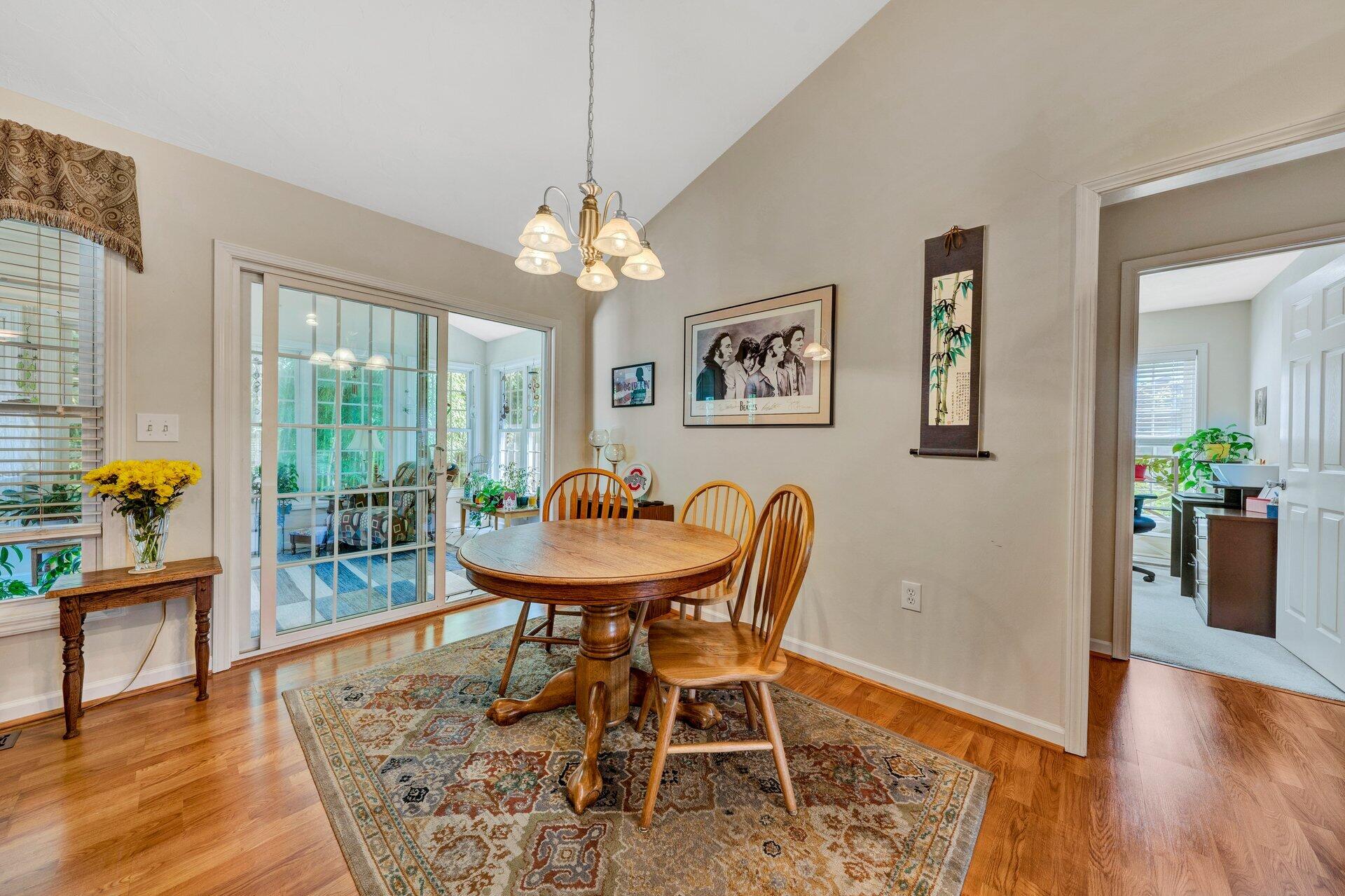 672 Kessler Mill Road Salem, VA 24153 - Photo 14 of 44 a view of a dining room with furniture wooden floor and a chandelier