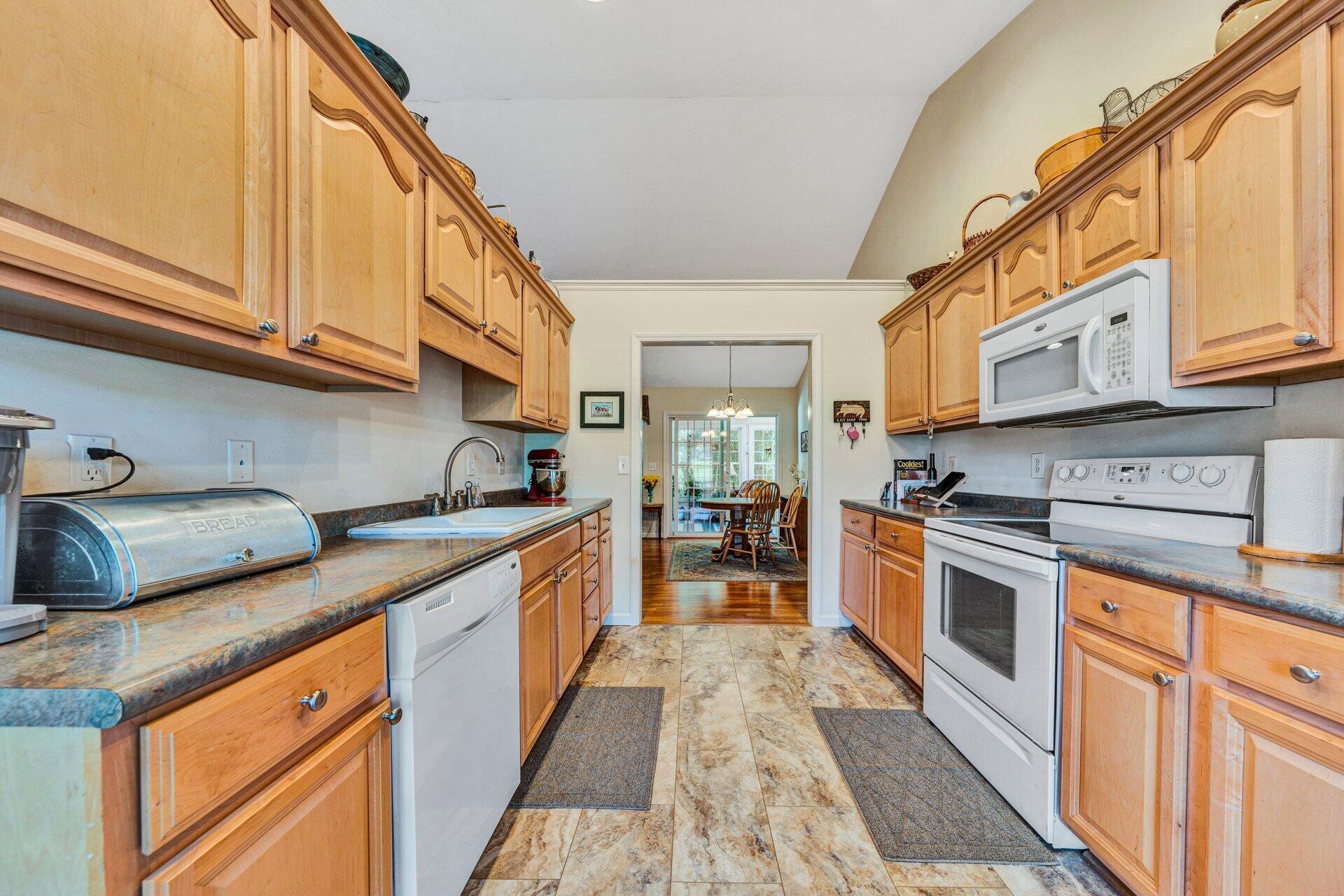 672 Kessler Mill Road Salem, VA 24153 - Photo 15 of 44 a kitchen with stainless steel appliances granite countertop a sink and cabinets