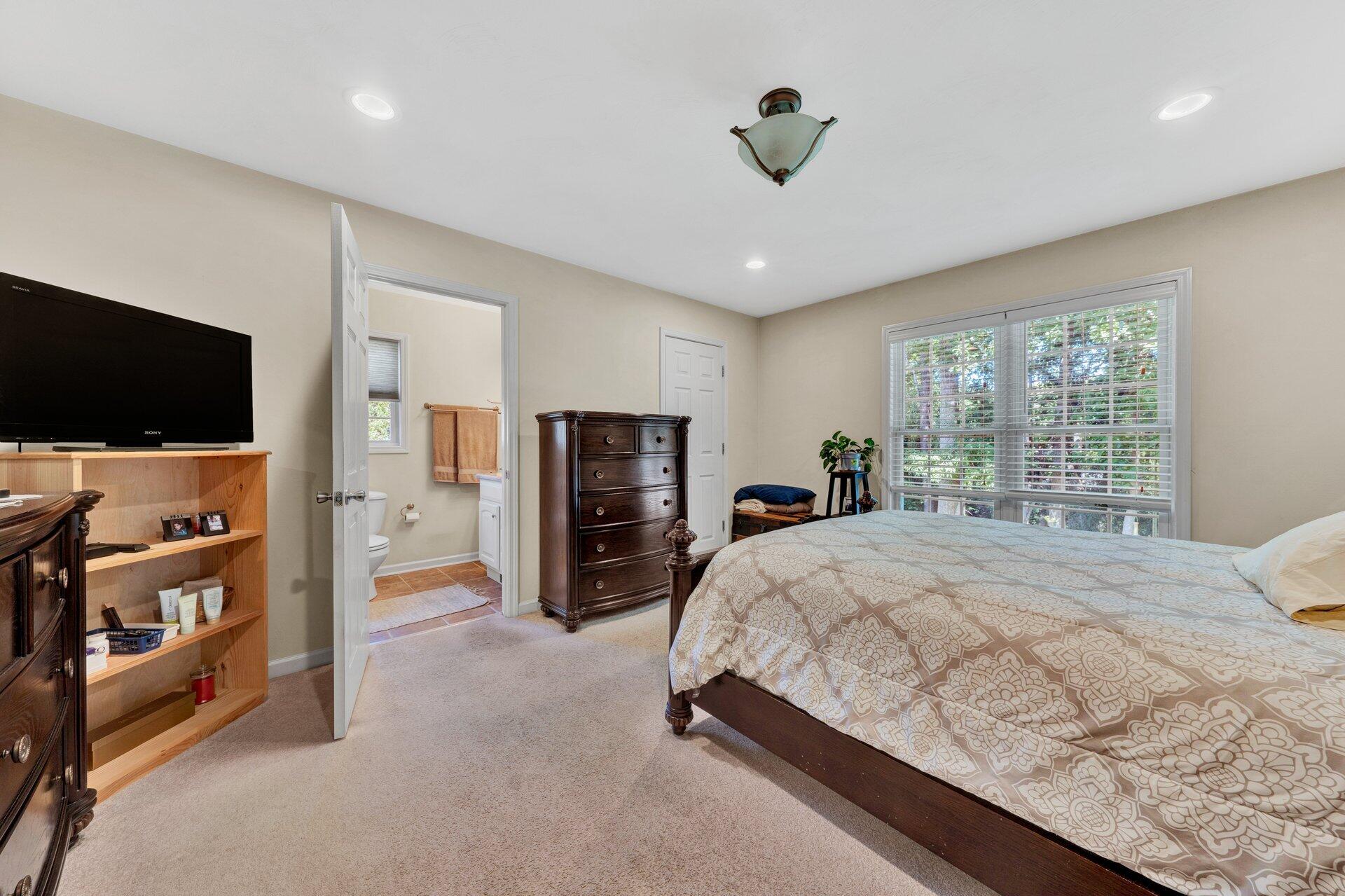 672 Kessler Mill Road Salem, VA 24153 - Photo 19 of 44 a bed room with furniture and a flat screen tv
