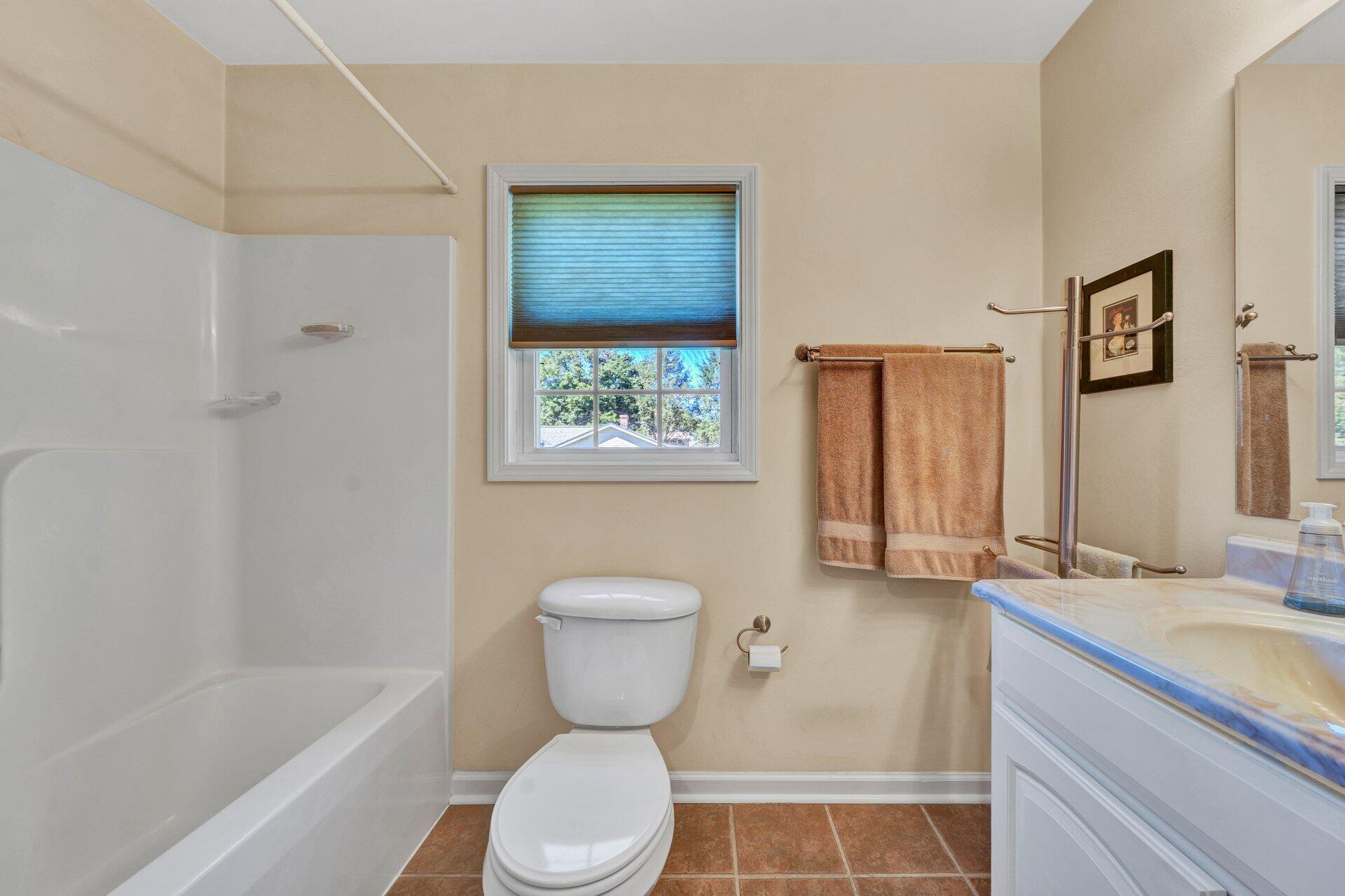 672 Kessler Mill Road Salem, VA 24153 - Photo 20 of 44 a bathroom with a granite countertop toilet a sink and bathtub