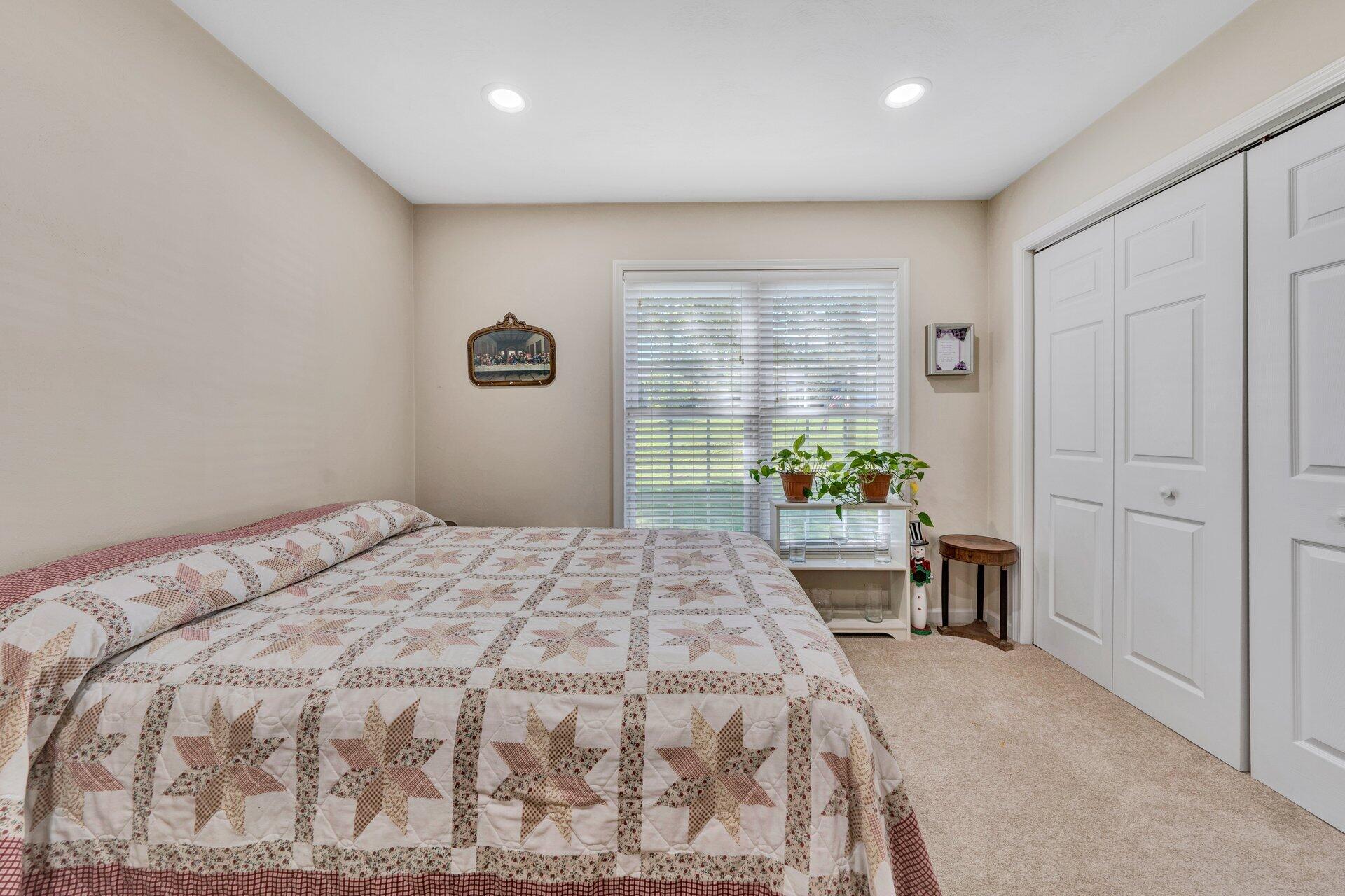 672 Kessler Mill Road Salem, VA 24153 - Photo 22 of 44 a spacious bedroom with a bed and a table