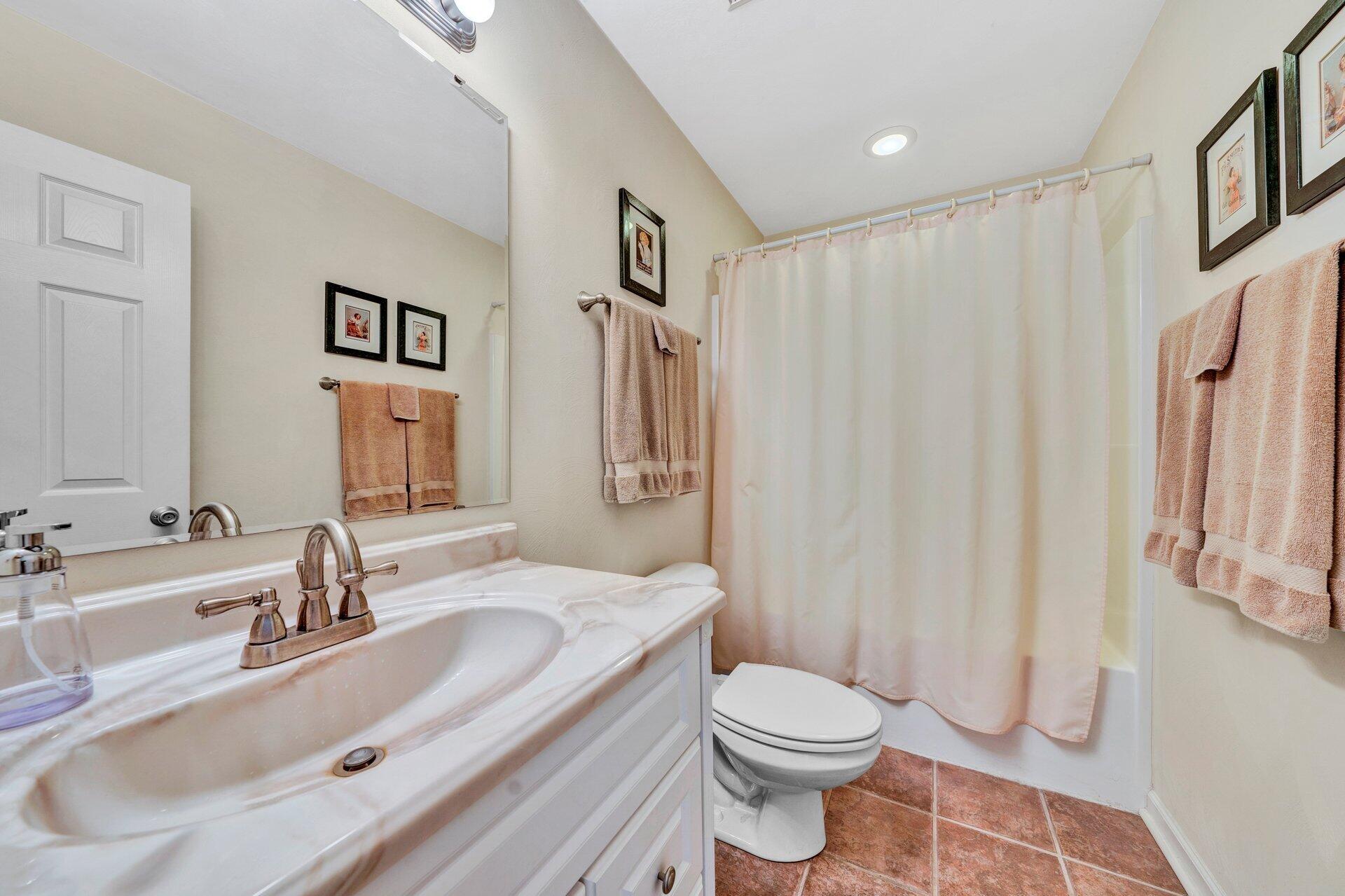 672 Kessler Mill Road Salem, VA 24153 - Photo 25 of 44 a bathroom with a sink toilet and shower