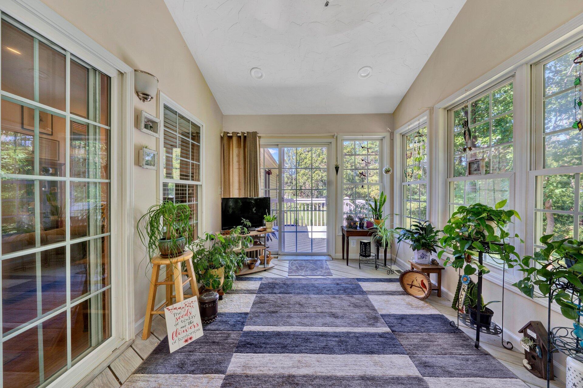 672 Kessler Mill Road Salem, VA 24153 - Photo 30 of 44 a living room filled with furniture windows and a potted plant