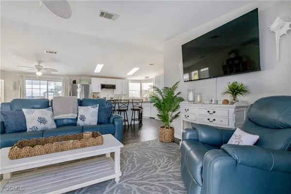 a living room with lots of furniture and a table