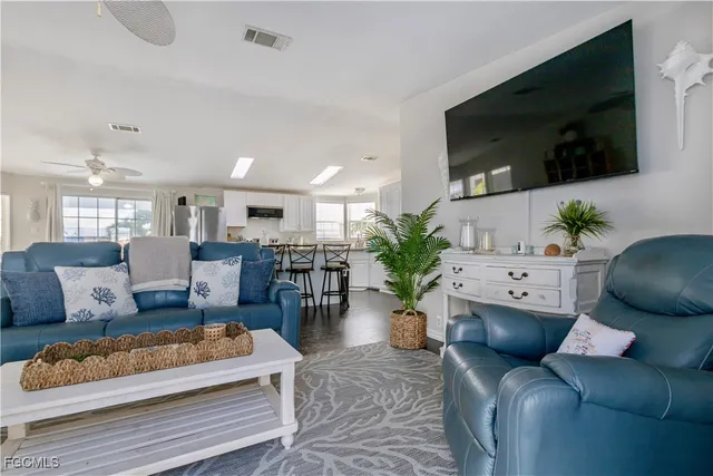 a living room with lots of furniture and a table