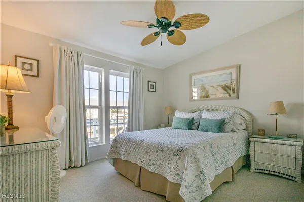 a view of house with wooden deck and furniture